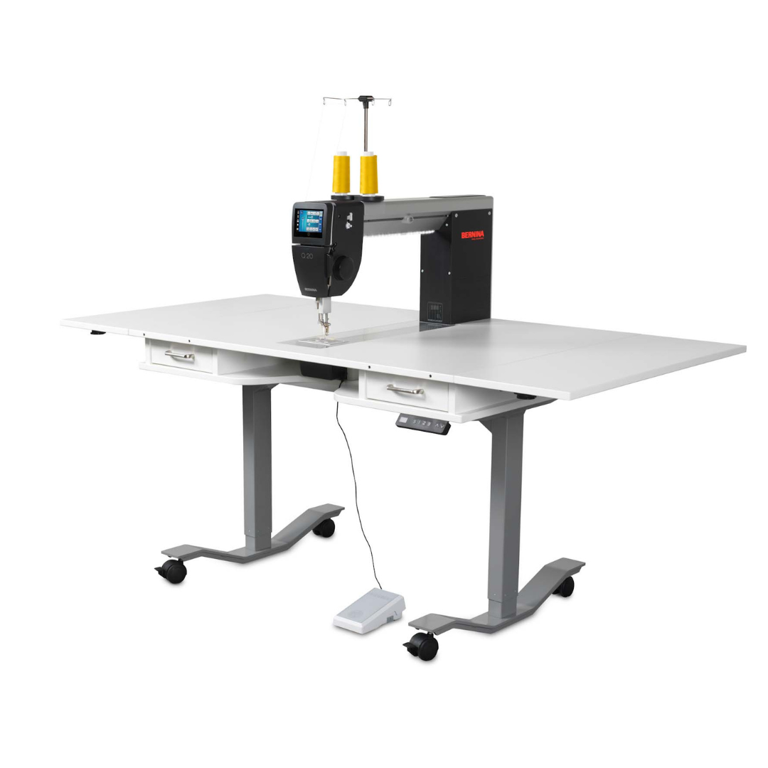 Sewing machine on a white table with a white background
