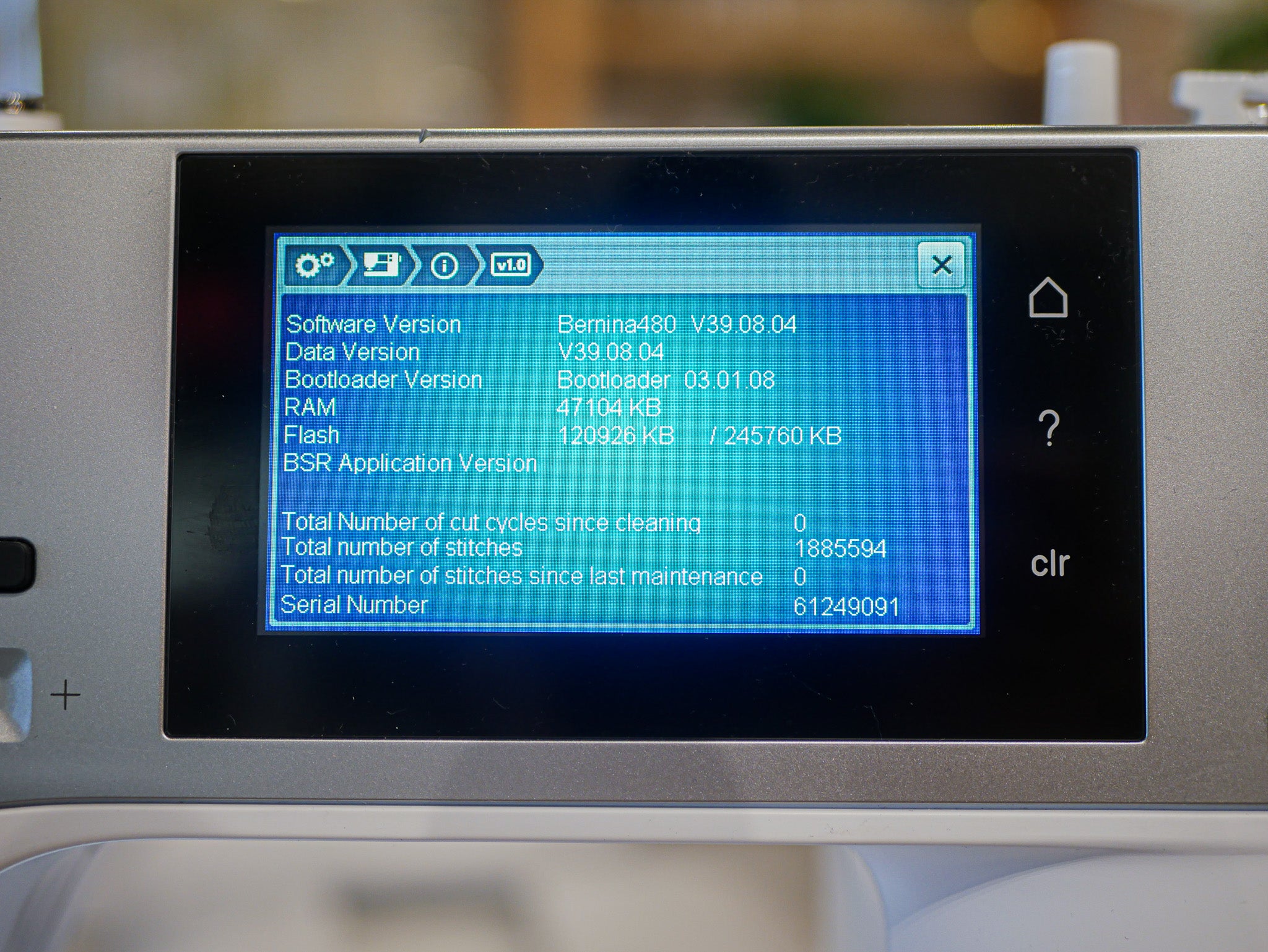 Display screen of a sewing machine showing technical information.