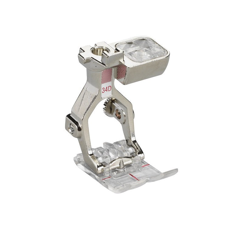 Sewing machine presser foot with clear plastic cover on a white background