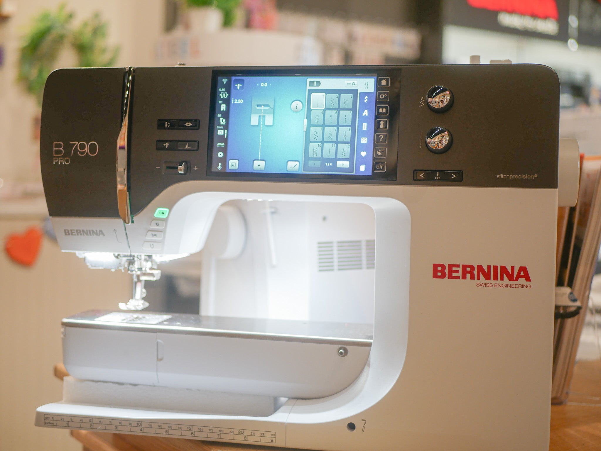 BERNINA sewing machine with digital display on a blurred background