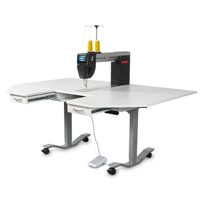 Sewing machine on a white table with a white background