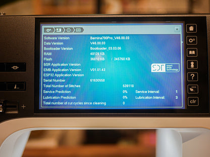 Display screen of a sewing machine showing technical details 