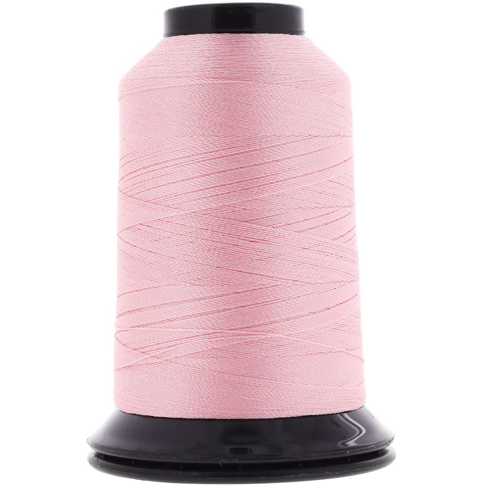 Spool of pink thread on a white background