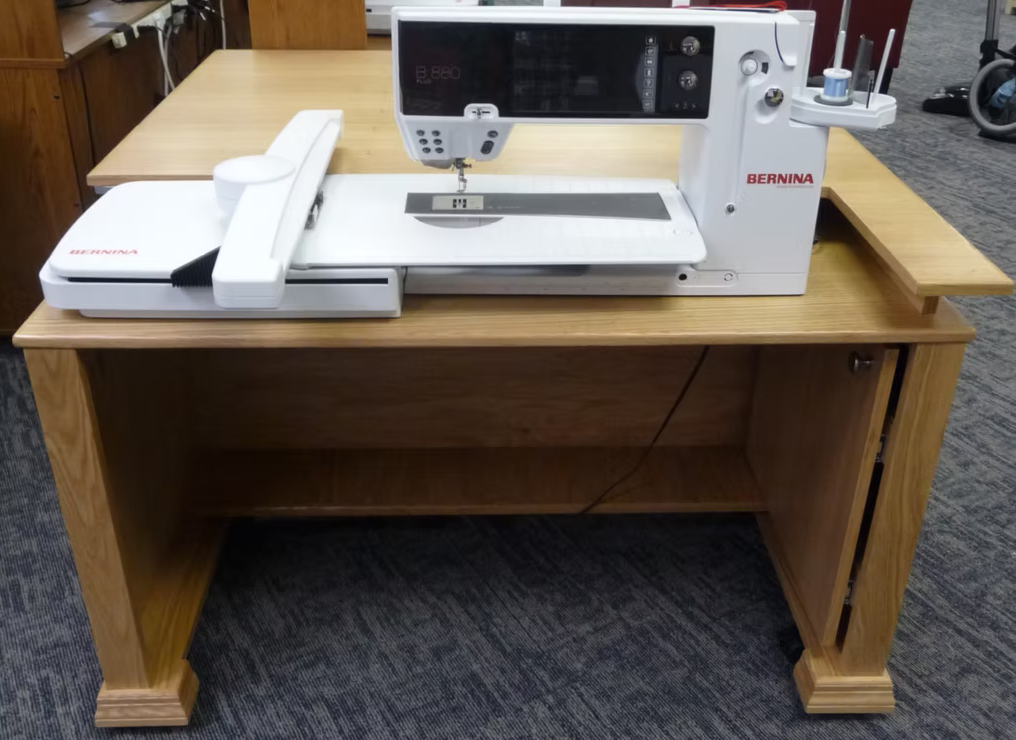 Bernina sewing machine on a wooden table in an indoor setting