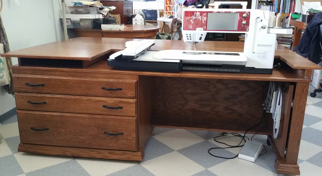 A Bernina sewing machine on a wood table in an indoor setting